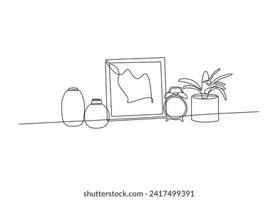 Single continuous line drawing of photo decoration on table. Luxurious interior. interior decoration minimalist concept. Bedroom. Very cozy rooms. Staycation. One line design vector illustration