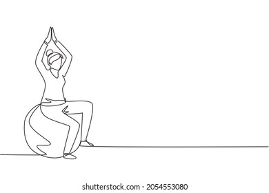 Single continuous line drawing physiotherapy rehabilitation isometric composition with female patient sitting on top of rubber ball with lifting both her hands. One line draw graphic design vector