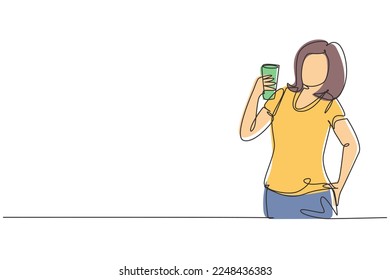 Single continuous line drawing portrait of happy young beautiful woman holding glass of orange juice. Make her refreshing in summer season. Dynamic one line draw graphic design vector illustration