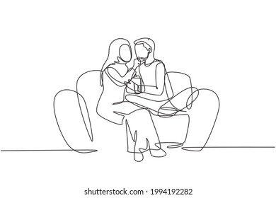 Single continuous line drawing romantic Arabian couple sitting relaxed together on sofa, woman feeding popcorn to man. Celebrate wedding anniversary. One line draw graphic design vector illustration