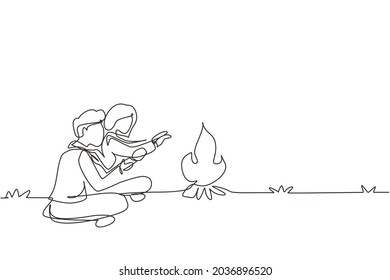 Single continuous line drawing romantic couple camping around campfire tents. Man woman warm their hands near bonfire sitting on ground. Nature trip. One line draw graphic design vector illustration