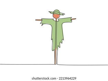 Single continuous line drawing of scarecrow installed by farmers to ward off pest birds which has damaged rice crops in the fields. Minimalism concept. One line draw graphic design vector illustration