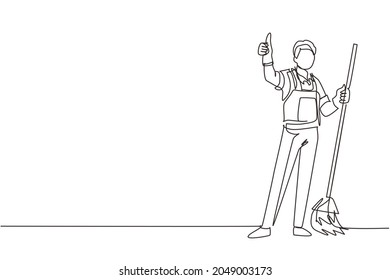 Single continuous line drawing smiling male cleaning company staff member holding broom and showing thumbs up gesture. Happy cleaning. Cleaning company logo. One line draw design vector illustration