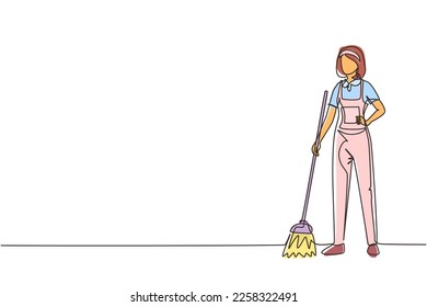 Single continuous line drawing smiling young woman janitor standing in uniform, sweeping the floor with broom, professional cleaning, home and office service. One line draw design vector illustration