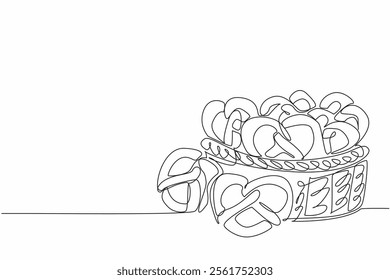 Single continuous line drawing some pretzels on wicker basket. Purchased lots for souvenir and to take home. Giving sweet food. Giving memory. National Pretzel Day. One line design vector illustration