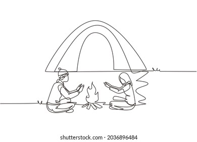 Single continuous line drawing traveling couple active recreation camping around campfire tents. Man and woman warm their hands near bonfire. Dynamic one line draw graphic design vector illustration