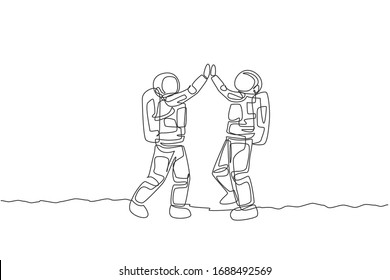 Single continuous line drawing of two young astronauts giving high five gesture to celebrate a success in moon surface. Space man cosmic galaxy concept. Trendy one line draw design vector illustration