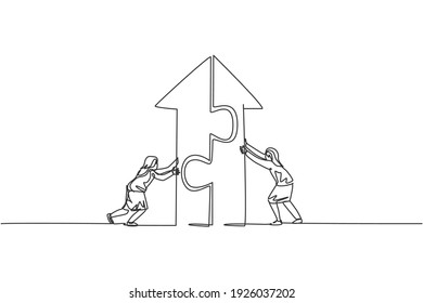 Single continuous line drawing two young female managers pushing puzzle to build up arrow building. Teamwork metaphor. Minimalism concept dynamic one line draw graphic design vector illustration