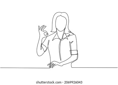 Single continuous line drawing woman in casual clothes gesturing ok sign. Okay sign, gesture language concept. Smiling female standing showing ok sign with fingers. One line draw graphic design vector