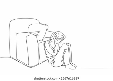 Single continuous line drawing woman sitting on floor leaning on single sofa, cover face with both palms. Deep heartbreak. Alone. National Anxiety Screening Day. One line design vector illustration