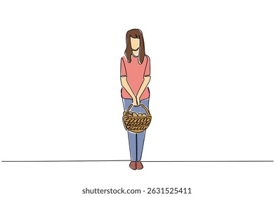 Single continuous line drawing a woman carrying a rattan basket filled with mushrooms with both hands. Hunt until get a large amount. National Mushroom Hunting Day. One line design vector illustration