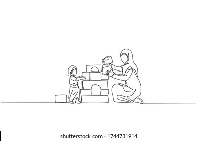 Single continuous line drawing of young Islamic mom playing block foam brick house with daughter at home, happy parenting. Arabian family care concept. Trendy one line draw design vector illustration