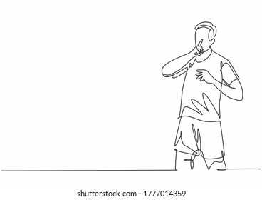 Single continuous line drawing of young sporty soccer player makes quiet gesture with his finger to the rival supporters. Match soccer goal celebration concept one line draw design vector illustration