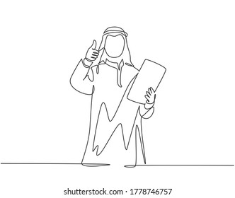 Single continuous line drawing of young muslim business manager give thumbs up and hold company rule policy. Arab middle east cloth shmagh, kandura, robe. One line draw design vector illustration