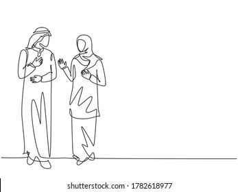 Single continuous line drawing of young muslim business couple discussing product sales strategy together. Arab middle east cloth shmagh, thawb, robe, hijab. One line draw design vector illustration