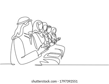 Single continuous line drawing of young male and female muslim workers clapping hands after heard a presentation. Arab middle east cloth hijab, thawb, robe. One line draw design vector illustration