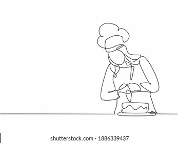 Single continuous line drawing young female chef decorating birthday pastry cake with whipping cream on restaurant kitchen. Bakery food concept one line drawing design vector minimalism illustration