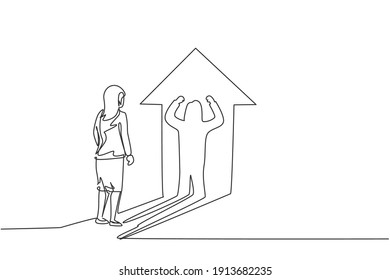 Single continuous line drawing of young beauty businesswoman facing her muscular shadow on arrow light. Professional worker. Minimalism concept dynamic one line draw graphic design vector illustration