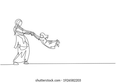 Single continuous line drawing of young Arabian mother playing and swinging her daughter fly. Islamic muslim happy family parenthood concept. Trendy one line graphic draw design vector illustration