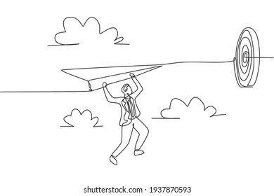 Single continuous line drawing young business man hanging on flying paper aircraft into target. Business goal metaphor concept. Minimalism dynamic one line draw. Graphic design vector illustration