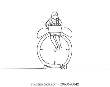 Single continuous line drawing young business woman sitting on big analog alarm clock and typing on laptop. Business time discipline metaphor concept. One line draw graphic design vector illustration.