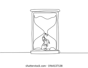 Single continuous line drawing young Arab business woman digging treasure inside hourglass. Getting a new business idea minimalist concept. Dynamic one line draw graphic design vector illustration.