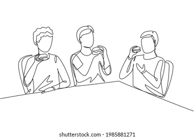 Single continuous line drawing young fun and smiling men together. Friends eating fast food meal in restaurant. Happy people sitting and having dinner hamburgers. One line draw graphic illustration