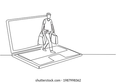 Single continuous line drawing young man coming out of laptop screen holding shopping bags. Sale, digital lifestyle and consumerism concept. Dynamic one line draw graphic design vector illustration