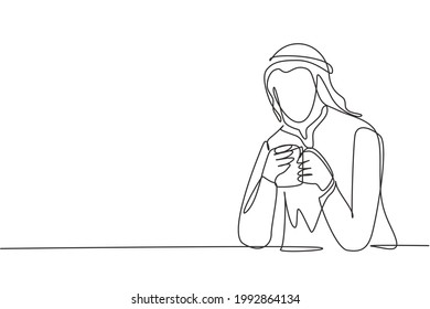 Single continuous line drawing young Arabian man sitting and holding a cup of coffee in one hand. Enjoy morning before work at office. Success person. One line draw graphic design vector illustration