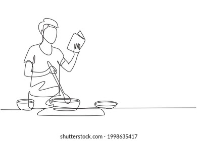 Single continuous line drawing young man cooking while reading book she is holding. Healthy food lifestyle concept. Cooking at home. Prepare food. One line draw graphic design vector illustration