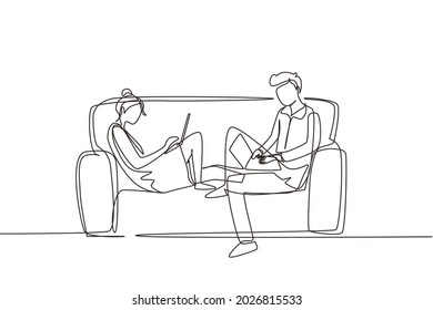 Single continuous line drawing young couple using laptop on sofa and obsessed with devices gadgets, people internet technology addiction concept. One line draw graphic design vector illustration