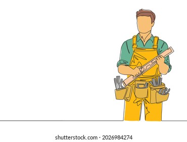 Single continuous line drawing of young handyman wearing building construction uniform while holding spirit level. Craftsman home repair service concept. One line draw design illustration