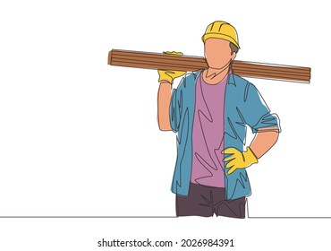 Single continuous line drawing of young lumberjack wearing helmet and glove while carrying stack of woods. Carpenter building maintenance service concept. One line draw design illustration