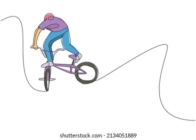 Single continuous line drawing of young BMX cycle rider show flying into the air trick in skatepark. BMX freestyle concept. One line draw design vector illustration for freestyle promotion art media