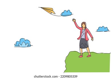 Single continuous line drawing of young business woman fly paper plane up to the sky. Professional entrepreneur. Minimalism metaphor concept. Dynamic one line draw graphic design vector illustration