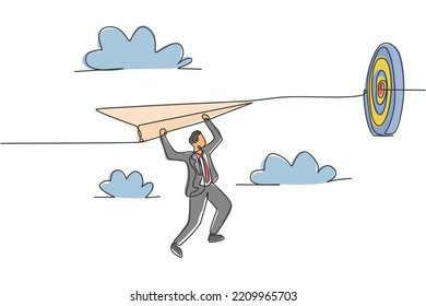 Single continuous line drawing young business man hanging on flying paper aircraft into target. Business goal metaphor concept. Minimalism dynamic one line draw. Graphic design vector illustration