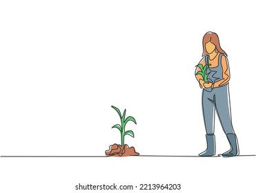 Single continuous line drawing young female farmer bring crops to be planted in farm fields. Successful farming activities minimalism concept. Dynamic one line draw graphic design vector illustration.