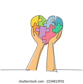 Single continuous line drawing of young happy man raised puzzle pieces up to the air together to form cute heart shape. Romantic game of love concept one line draw design graphic vector illustration