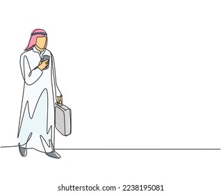 Single continuous line drawing of young male muslim worker watching smartphone screen to monitor the job. Arab middle east cloth shmagh, kandura, thawb, robe. One line draw design vector illustration