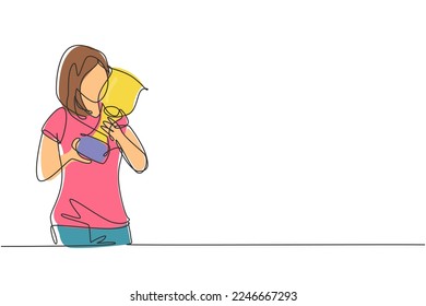Single continuous line drawing young female athlete wearing jersey kissing national sports competition championship trophy. Proud achievement. Dynamic one line draw graphic design vector illustration