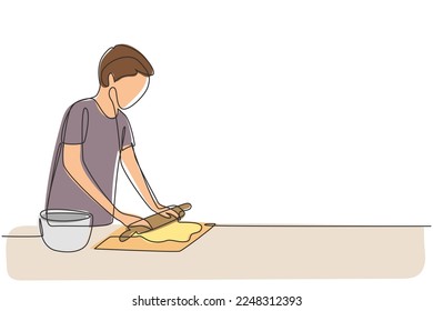 Single continuous line drawing young man making cookie dough using rolling pin at cozy kitchen table. Making bakery and homemade pizza at home. Dynamic one line draw graphic design vector illustration