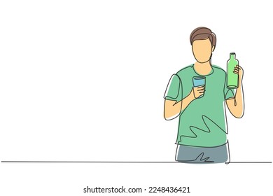 Single continuous line drawing young handsome man holding bottle in one hand and glass of orange juice in the other while having breakfast at home. One line draw graphic design vector illustration