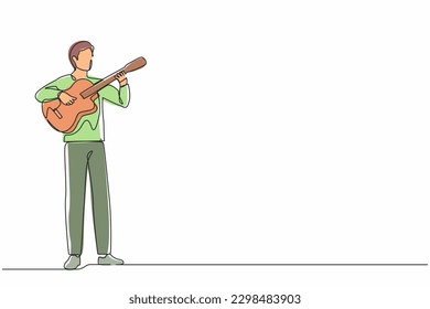 Single continuous line drawing young man playing acoustic guitar. Teenage boy musician playing strings at musical performance. Professional musician. One line draw graphic design vector illustration