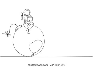 Single continuous line drawing young astronaut sitting on large bomb with a burning fuse holding laptop raise one hand. Reckless expeditions jeopardize research. One line design vector illustration