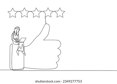 Single continuous line drawing young smiling Arabian man sitting on thumbs up typing on laptop. Happy satisfied Arabian man giving 5 gold stars. Online shop review. One line design vector illustration