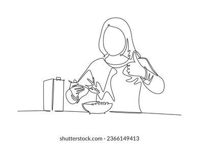 Single continuous line drawing of young happy woman eating breakfast with cereal and milk and giving thumbs up. Healthy nutrition food concept. Dynamic one line draw graphic design vector illustration