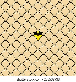 Single Cool Yellow Chick in Sunglasses Surrounded by Identical Brown Eggs