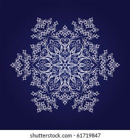 Single detailed snowflake on dark blue background