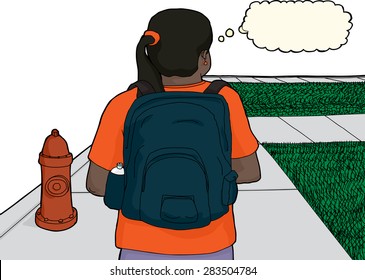 Single female Hispanic student walking near fire hydrant