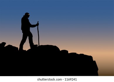 Single hiker silhouetted at mountain summit